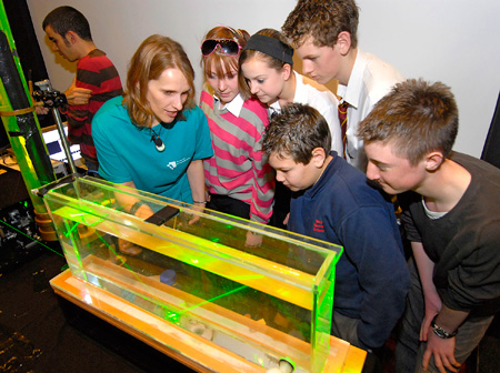 Some interested students being taught about lasers